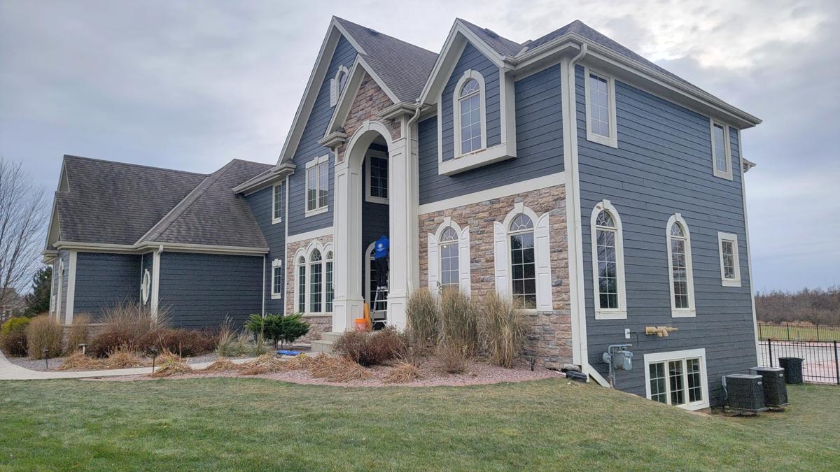 Home exterior by Precision Home Exteriors